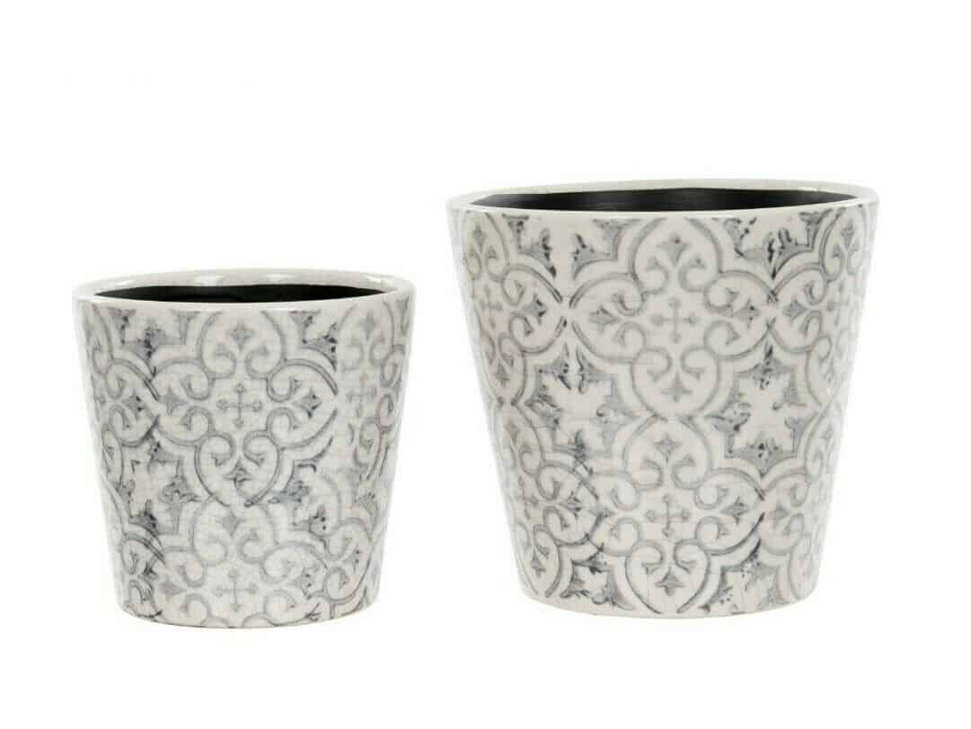Two light grey flower pots with intricate white pattern. Situated on a white studio background