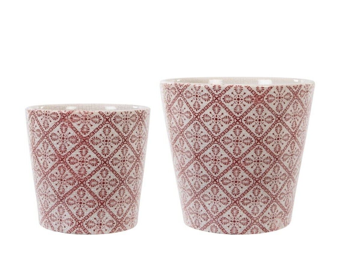 Two ceramic pots of floral, red check design. Situated on a white studio background