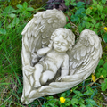 Serene Cherub Stone Statue
