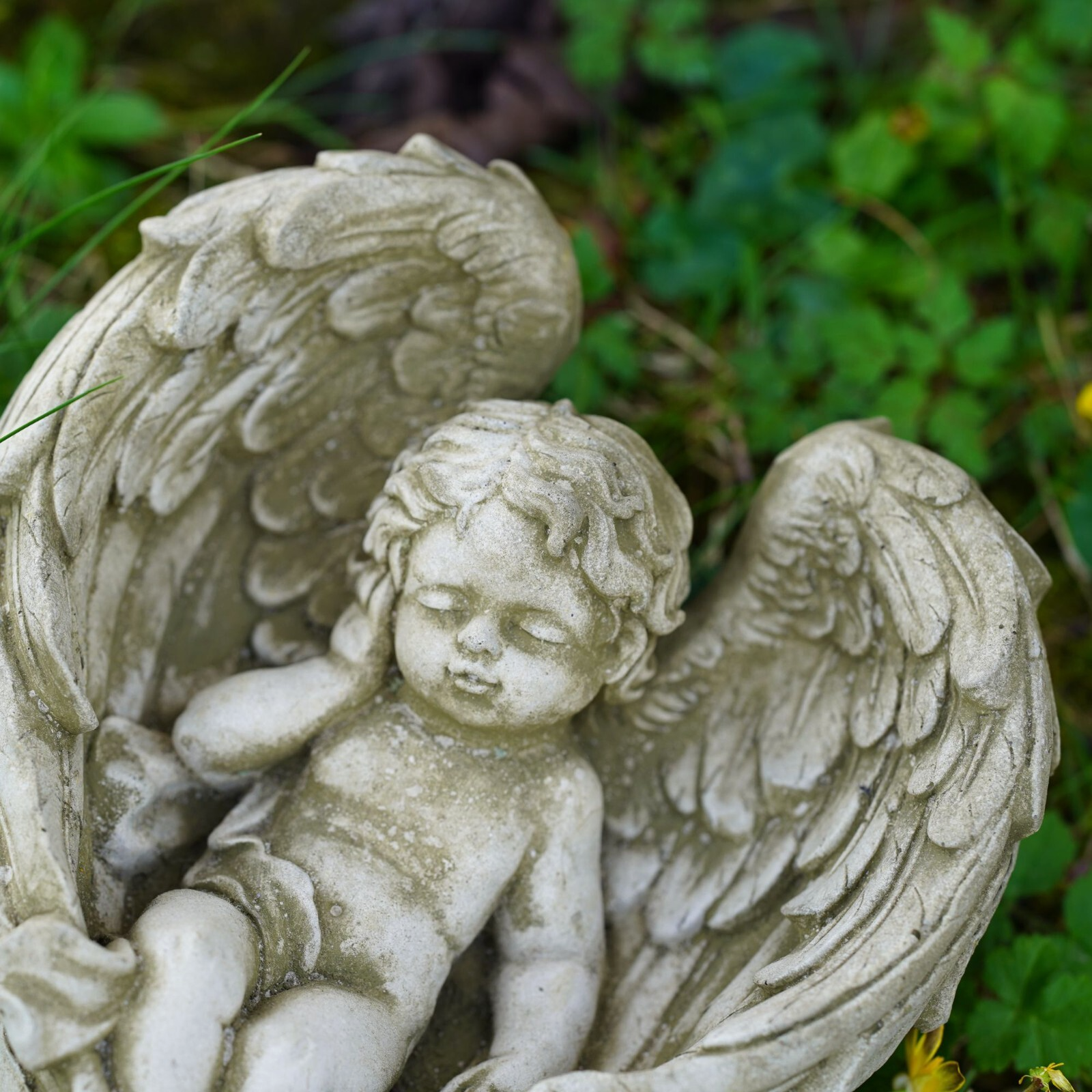 Serene Cherub Stone Statue