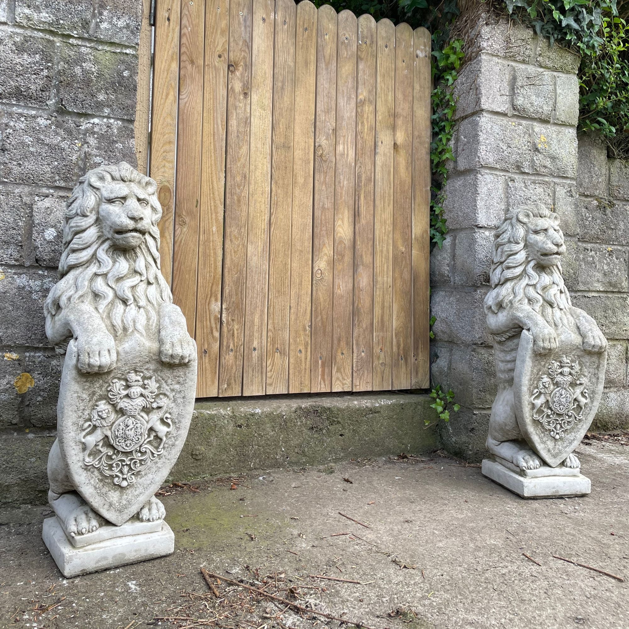 Pair of Armorial Lion Stone Statues