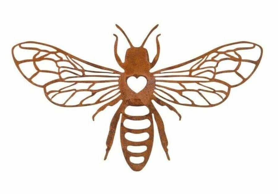 A 2D honey bee hanging plaque with a heart centre and splayed wings. Situated on a white studio background